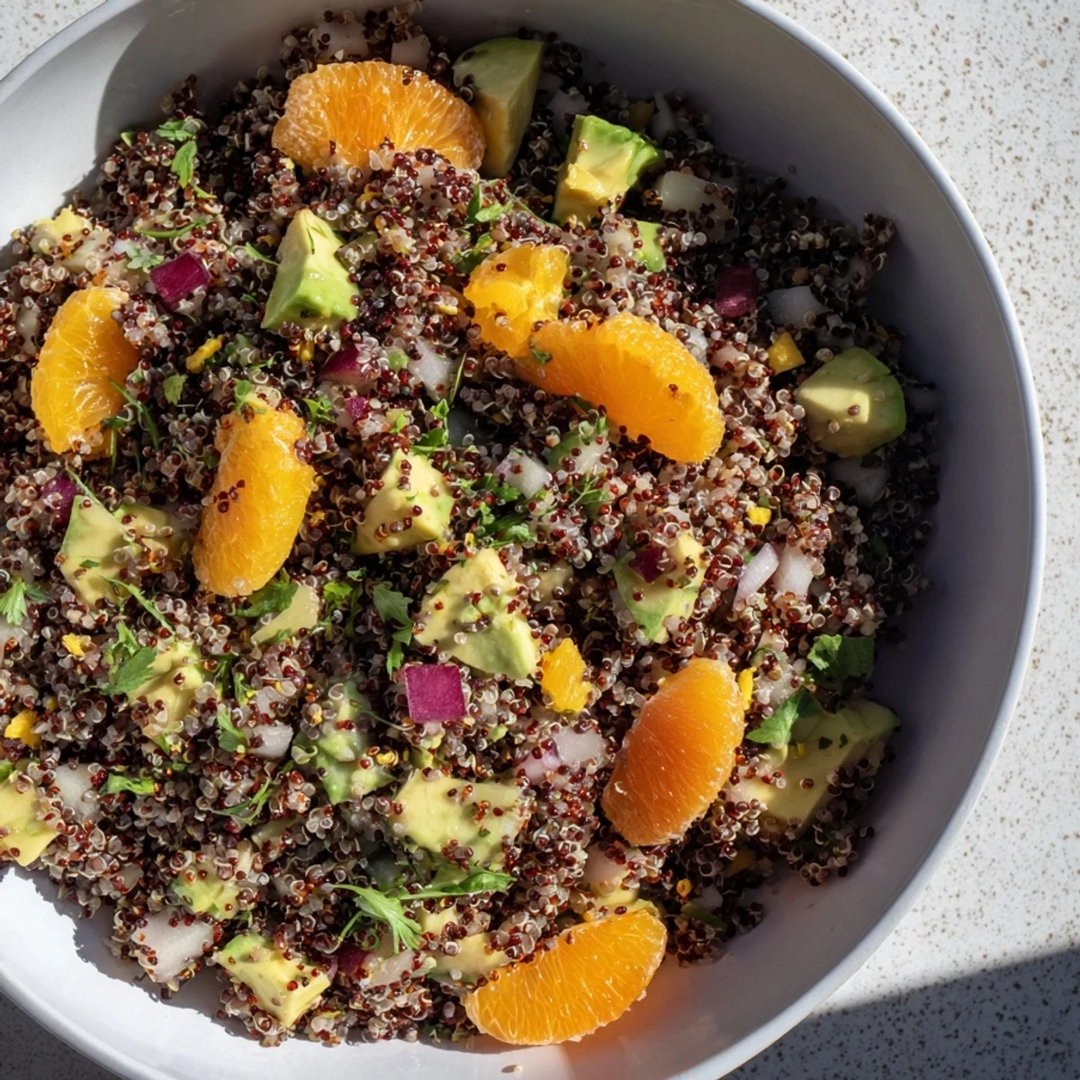 Enjoy a healthy Fresh Citrus & Avocado Quinoa Bowl, a delicious vegetarian salad bursting with flavor.