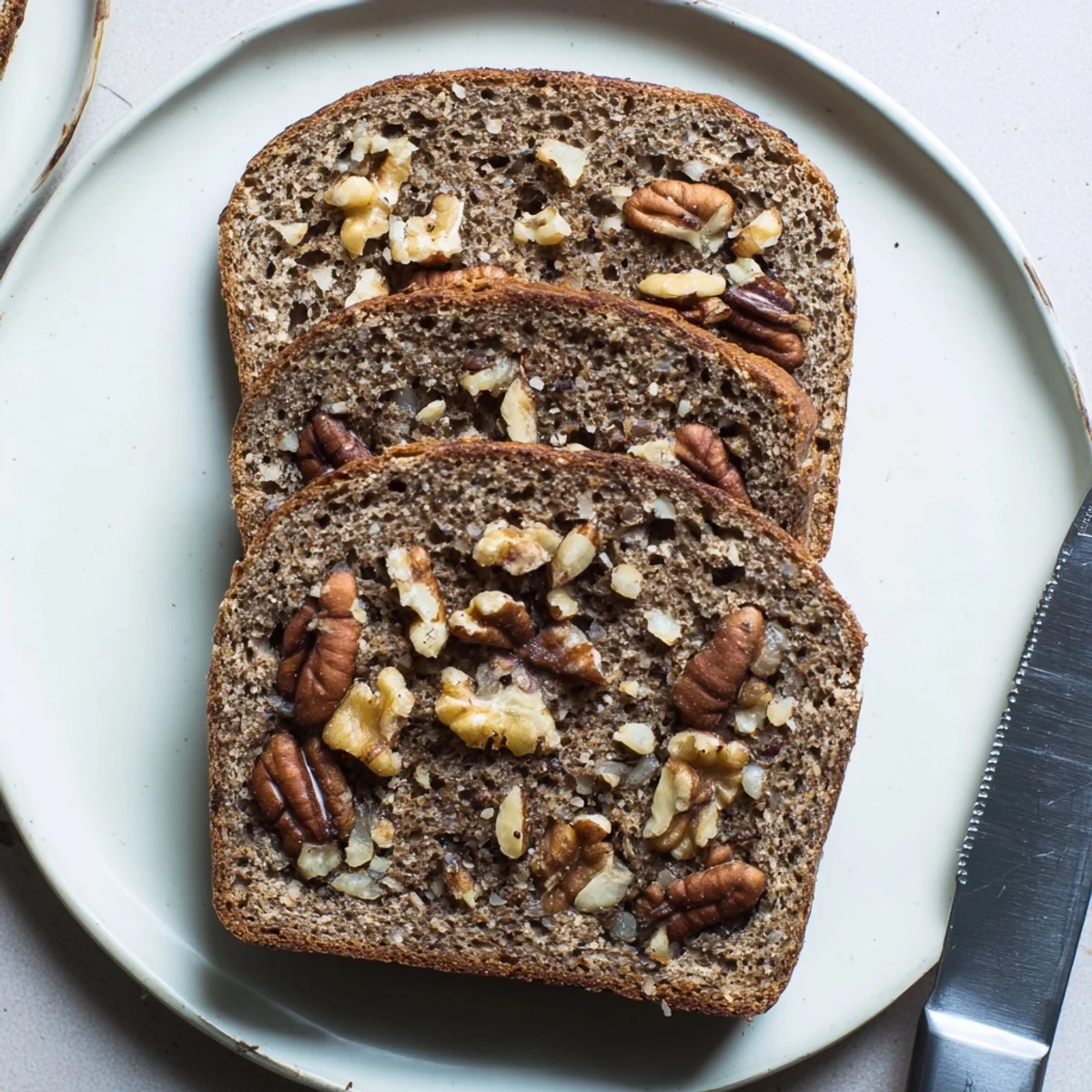 Golden-brown, crusty Nutty Whole Wheat Loaf Bread, perfect for sandwiches and toast with melting butter.