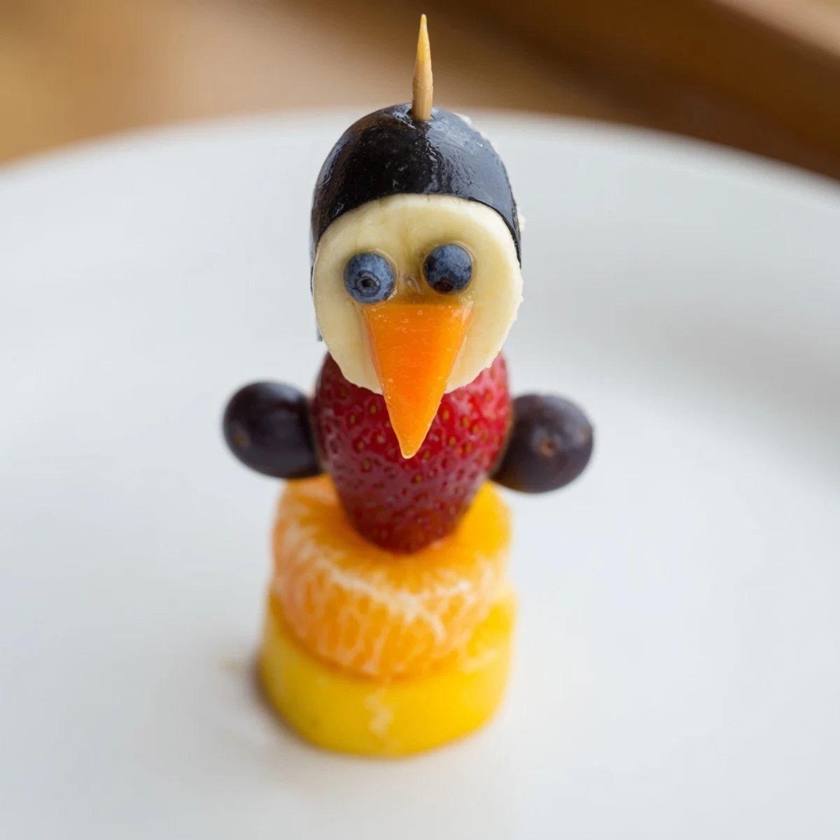 Vibrant Penguin Fruit Skewer Army featuring juicy grapes, strawberries, and blueberries perfect as a party snack.