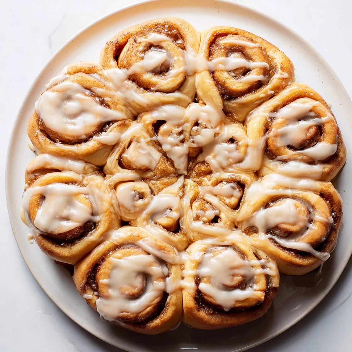 A beautiful holiday breakfast, a Giant Snowflake Sweet Roll, decorated with sweet icing and served.