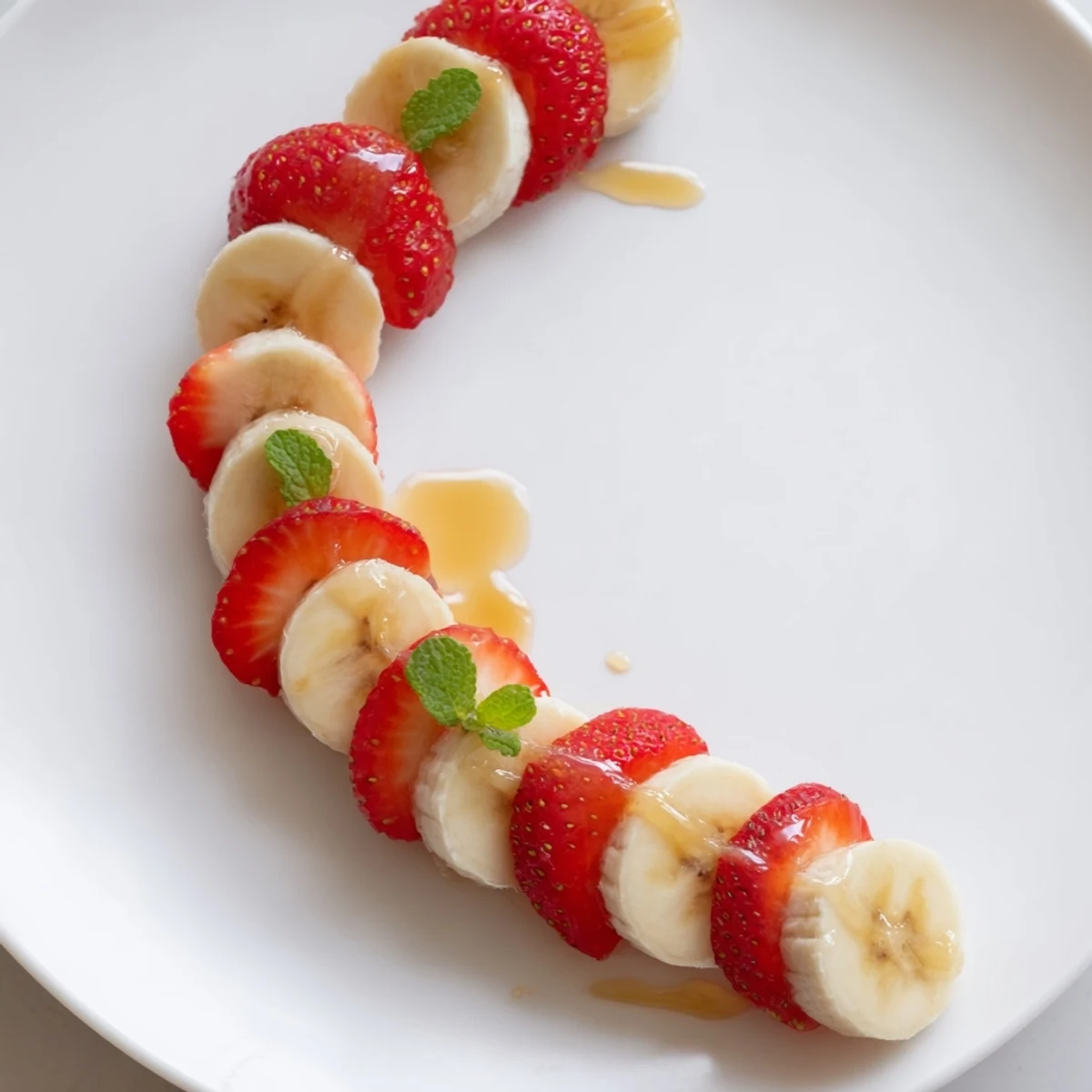 Vibrant image of Banana Strawberry Candy Cane slices arranged creatively for a beautiful, festive treat.