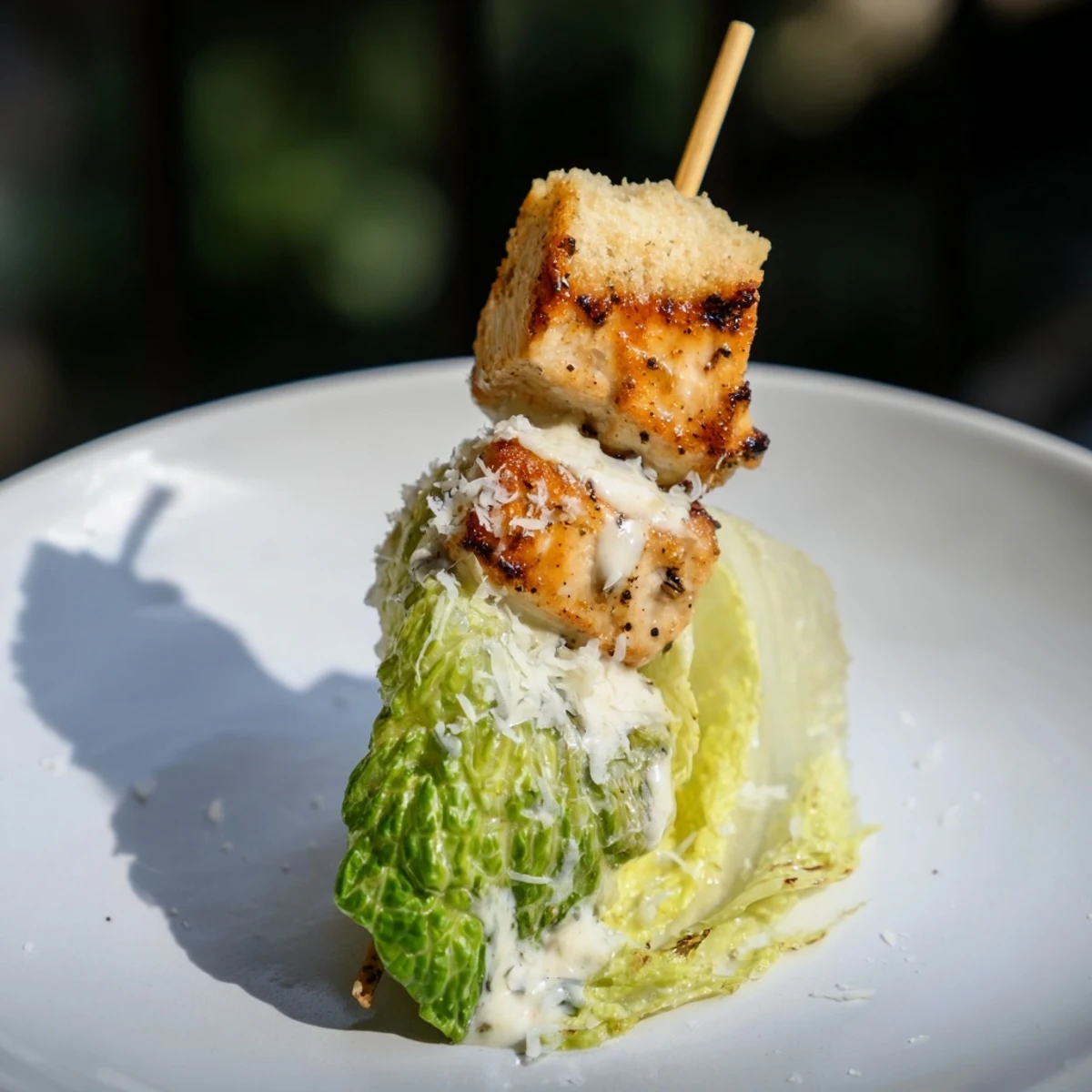 Enjoy savory Chicken Caesar Salad Skewers, a perfect mix of grilled chicken, croutons, and Caesar dressing.