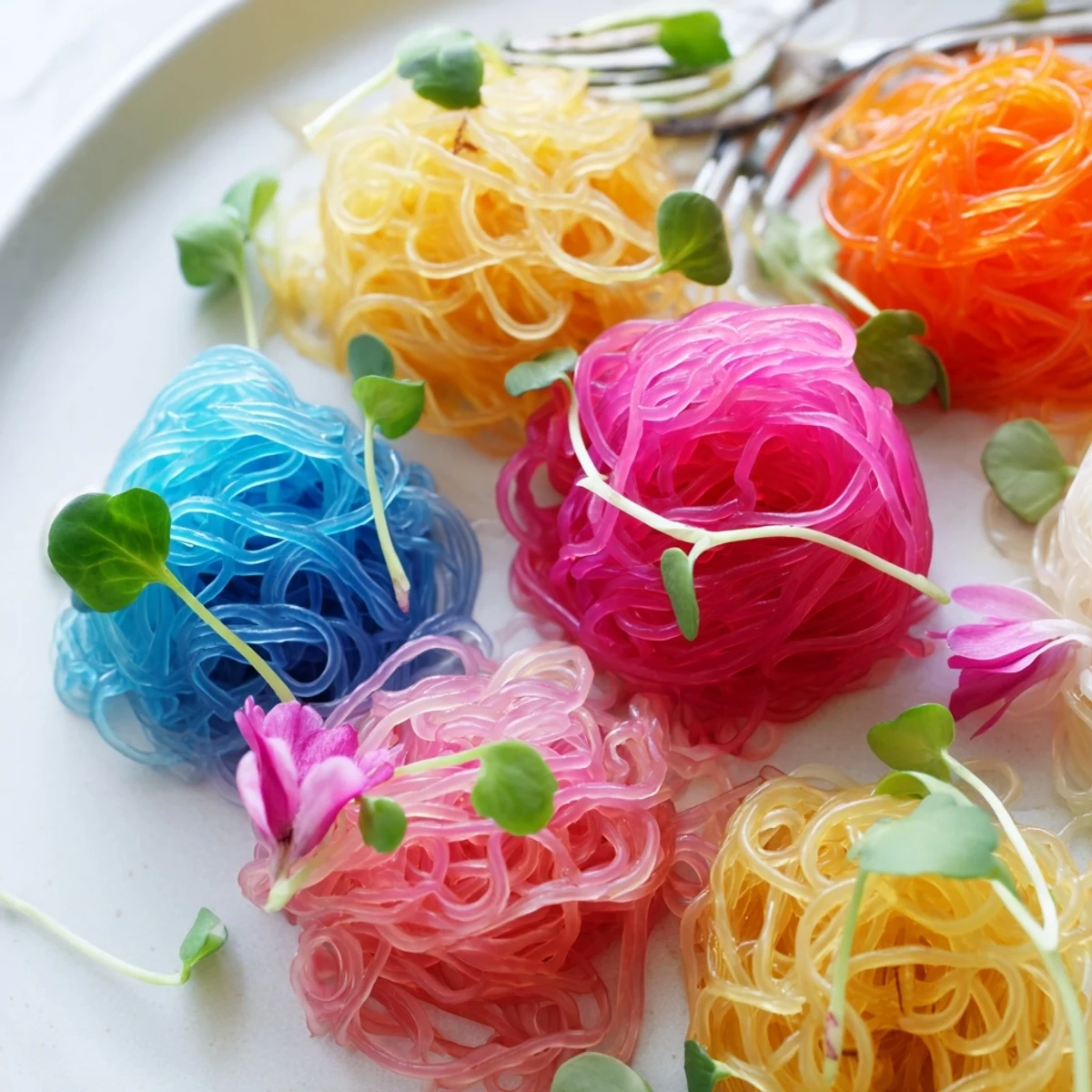 A close-up of eye-catching Neon Noodle Clouds, bright and bouncy, perfect for a fun, gluten-free appetizer.