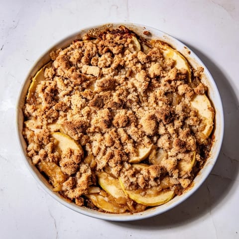 The golden crumble topping on this warm Rustic Apple and Cinnamon Crumble looks wonderfully crisp and inviting.