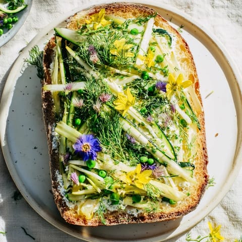 These beautiful Fresh Meadow-Inspired Garden Vegetable Tartines offer a delightful combination of textures and flavors on toasted bread.