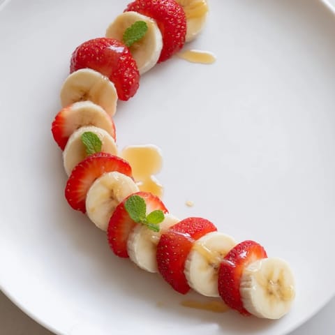Vibrant image of Banana Strawberry Candy Cane slices arranged creatively for a beautiful, festive treat.