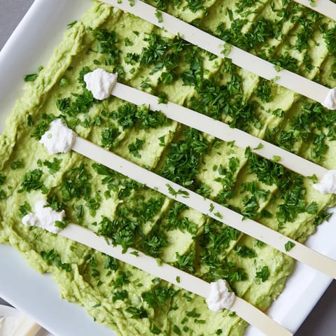 Delectable Game Day Football Field Snack Board boasts an inviting arrangement of snacks and dips for easy sharing.