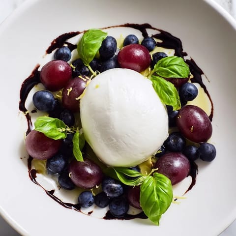 The Moonlit Lagoon salad, fresh blueberries and grapes with a balsamic glaze and fluffy burrata.