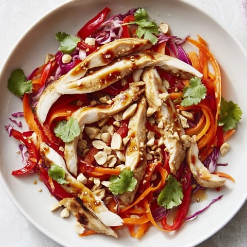 Imagine the vibrant colors of this Carrot Ribbon and Chicken Slaw with crunchy veggies and a creamy dressing.