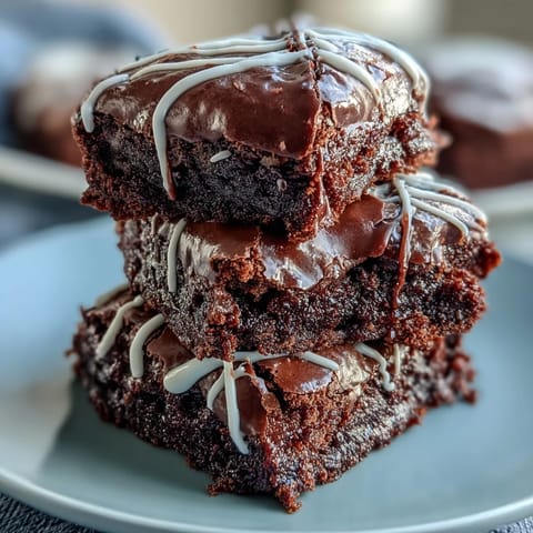 Delicious baseball-themed brownie bites with white icing laces, perfect for game day or sports parties.