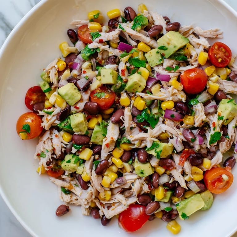 Close-up of a flavorful Dense Southwestern Bean Salad, showcasing fresh ingredients and creamy dressing.