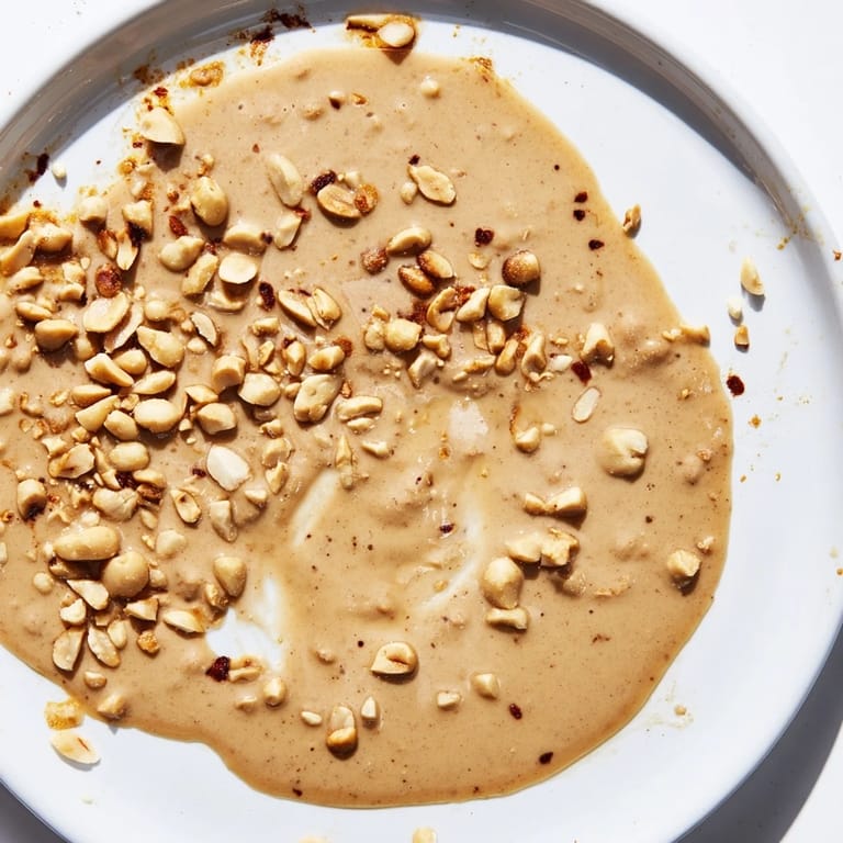 Picture warm, spiced Indonesian satay sauce; the thick, glossy sauce is ideal for satay skewers.