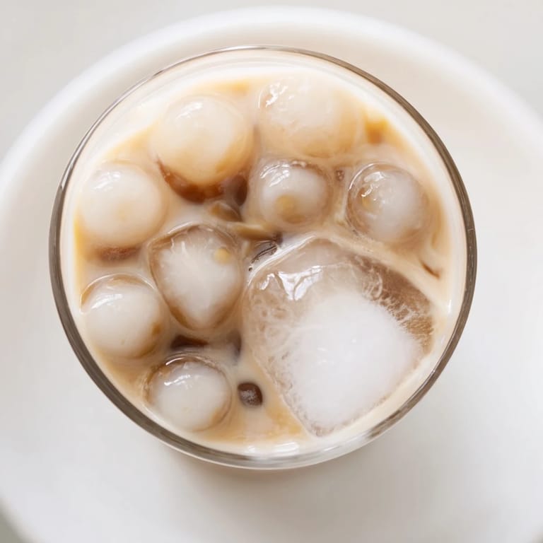 Instant bubble tea recipe featuring black tea, milk, and sweetened condensed milk ready in about ten minutes.