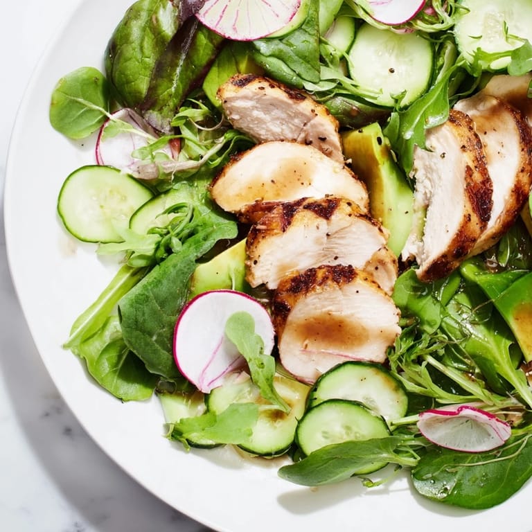 Spring Detox Chicken Salad is plated with creamy avocado, showcasing a light lemon vinaigrette in a fresh, healthy bowl.