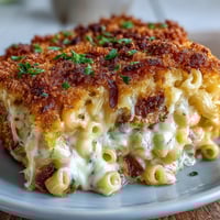 A bubbling casserole of soul food baked mac and cheese, crowned with a crisp, golden panko topping.
