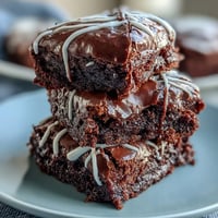 Delicious baseball-themed brownie bites with white icing laces, perfect for game day or sports parties.